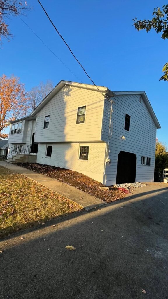 Freshly painted house exterior in fall, painted by GF Painting Services in the Wakefield, MA area