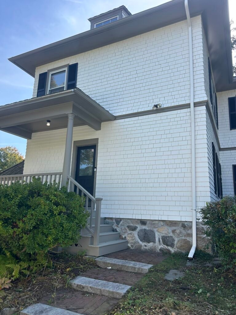 Older Wakefield-area home with freshly painted exterior and porch by GF Painting Services